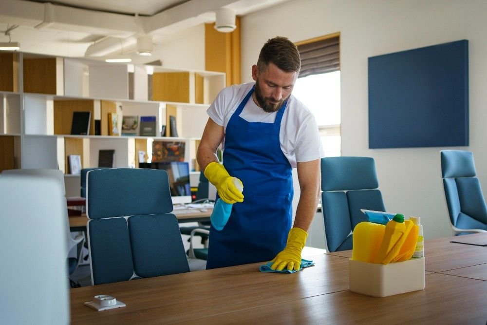 Commercial Cleaning Companies service person cleaning office